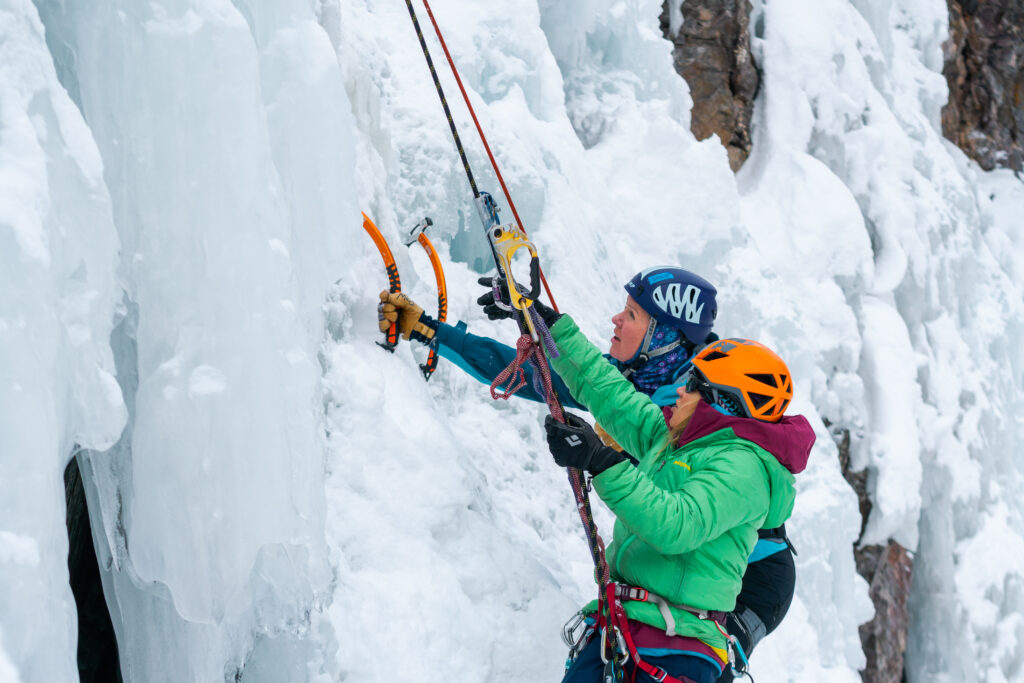 A climber and guide on an ice wall in Ouray Ice Park
