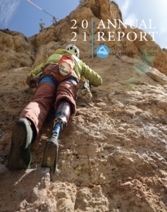 2021 Annual Report front page, image of a climber from below on a climb