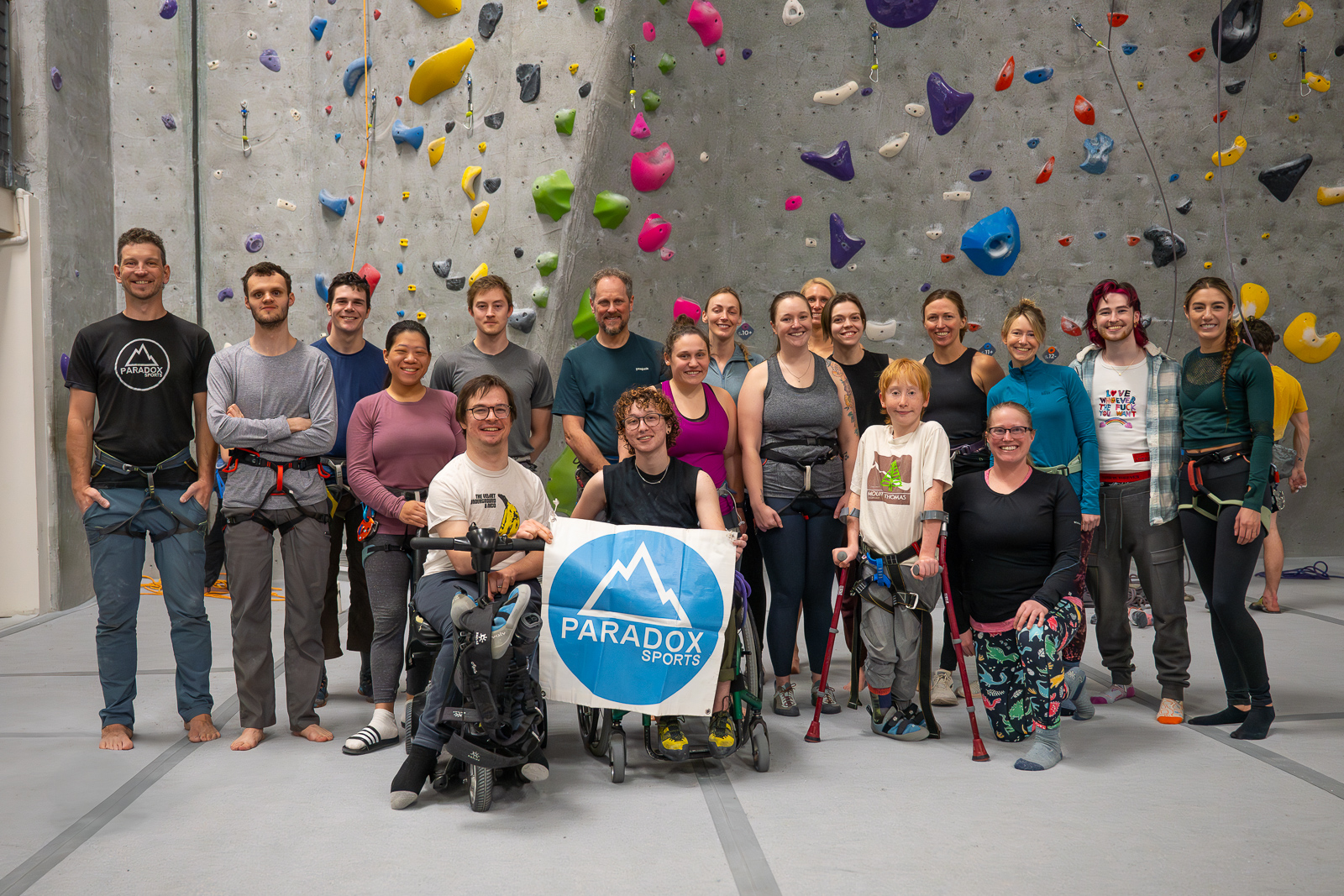 Group photo in front of the rock wall at Movement Boulder. Photo by Tristan Blommer.
